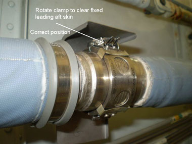 The clamp joining the two wing heat anti-ice tubes must be rotated so the clamp is in the up or down position to avoid chafing the leading edge's aft close-out skin.