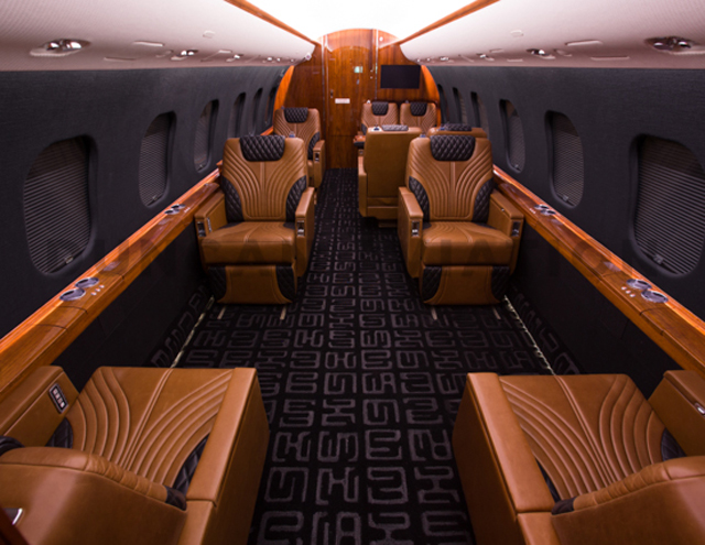 Black interior with warm caramel upholstery in Global Express