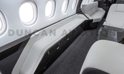 White drink rail in modern interior refurbishment of Falcon 2000