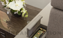 Divan arm rest with hidden controls on refurbished Falcon 900 by Duncan Aviation