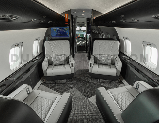 Gray leather club seats with black and white interior in Challenger 604