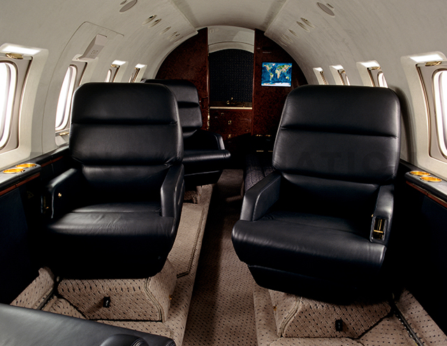 Sleek black upholstery in Hawker 800