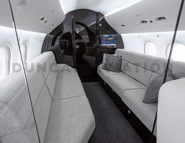 Sleek gray divans in Falcon 2000 interior refurbishment