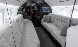 Sleek gray divans in Falcon 2000 interior refurbishment