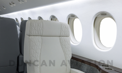 Full club seat upholstered in white leather with star stitching on edges in Falcon 900