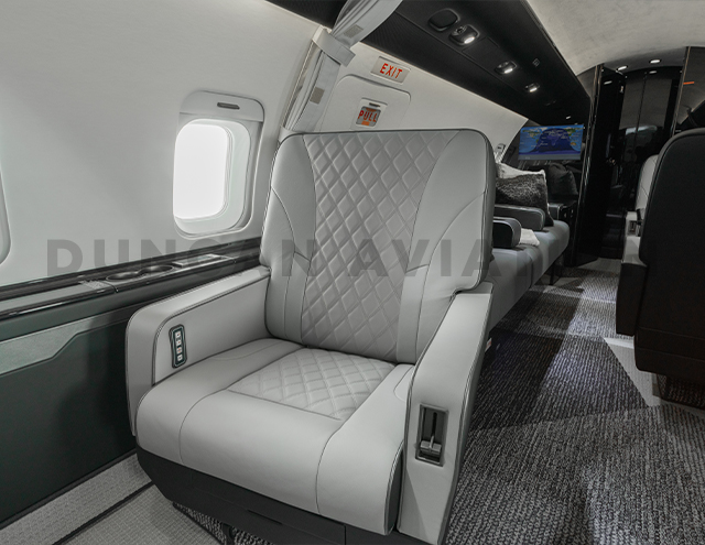 Challenger 604 with white leather upholstered club seat with custom diamond stitching