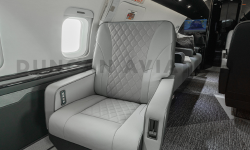 Challenger 604 with white leather upholstered club seat with custom diamond stitching