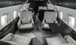 Four leather club seats in gray interior of Challenger 604