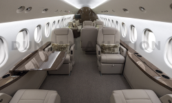 View of entire cabin of newly refurbished Falcon 900 with cool beige leather, dark brown carpet, and dark wood on drink rails