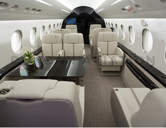 Falcon 2000 with updated cream upholstery and dark wood finishes