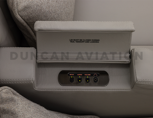 Arm rest in newly refurbished Falcon 900 with pop up controls