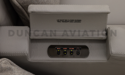 Arm rest in newly refurbished Falcon 900 with pop up controls
