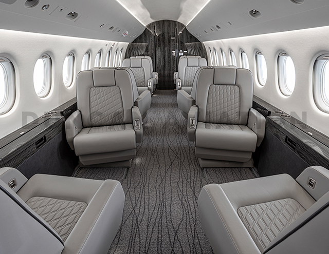 Dove gray club seats with custom stitching on Falcon 2000 interior refurbishment