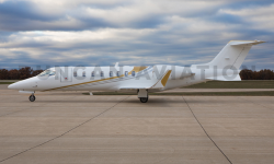 Learjet 45 exterior with white paint and gold accents