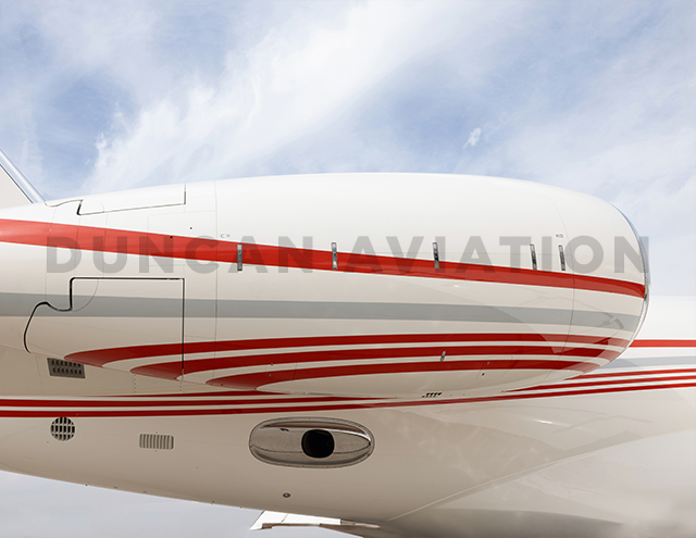 Close up of engine on newly painted Gulfstream 650 with red stripes by Duncan Aviation