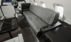 Gray leather divan in Challenger 604