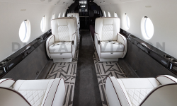 Newly refurbished interior of Gulfstream 200 with white leather and dark piping