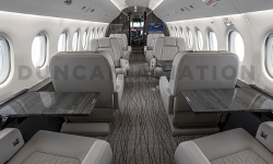 Eight club seats with six tables in Falcon 2000 interior refurbishment