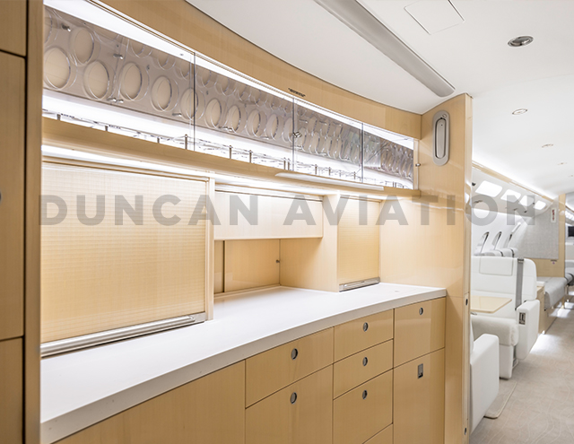 Blonde wood galley on interior of a Global aircraft