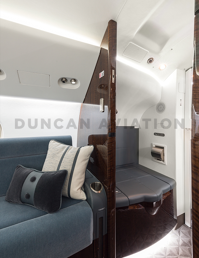 Dusty blue and cream fabrics on seating in Falcon 900