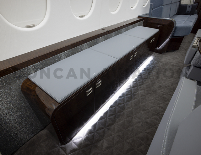 Credenza with additional cabinets underneath in Falcon 900
