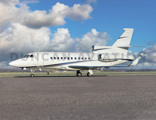 Exterior of Falcon 900 in white with blue stripe painted by Duncan Aviation