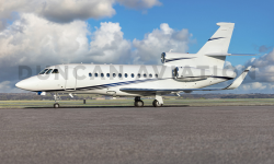 Exterior of Falcon 900 in white with blue stripe painted by Duncan Aviation