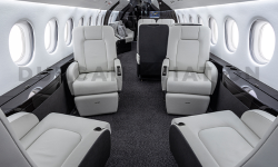 Four white leather club seats in Falcon 2000 interior refurbishment