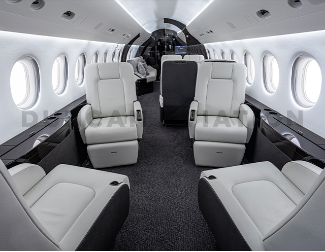 Four white leather club seats in Falcon 2000 interior refurbishment
