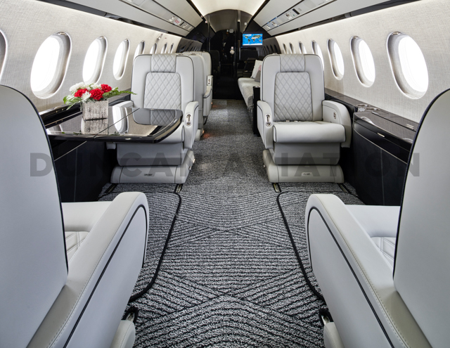 Sleek black and white interior of updated Falcon 2000