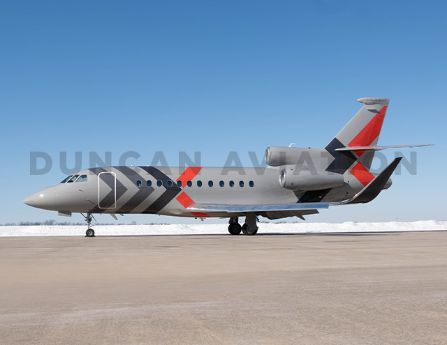 Exterior of Falcon 900 with gray paint and dark gray and red accents