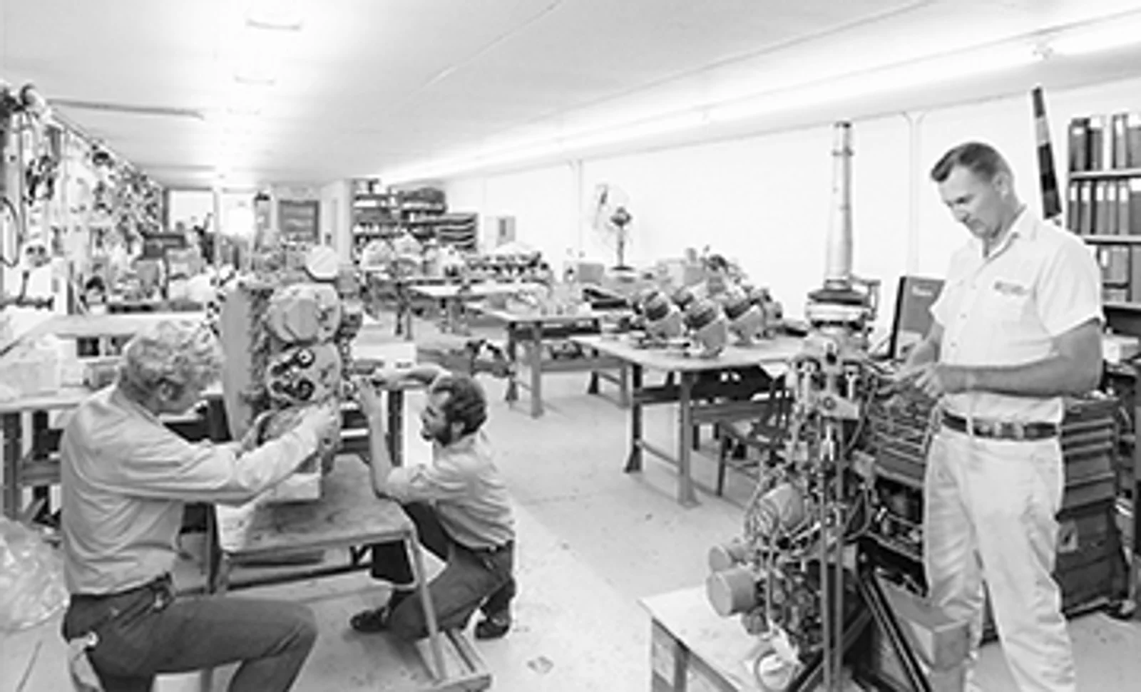 Doug Hill, Joe Huffman Sr., and Tex Hoveland working on a Bell 47 Lycoming helicopter engine in the late 70s.