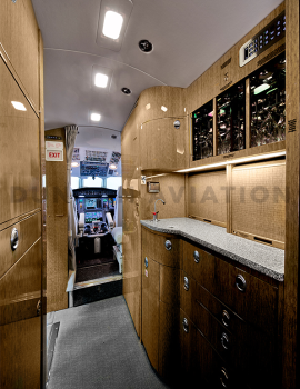 Galley in light wood tones of refurbished Falcon 900